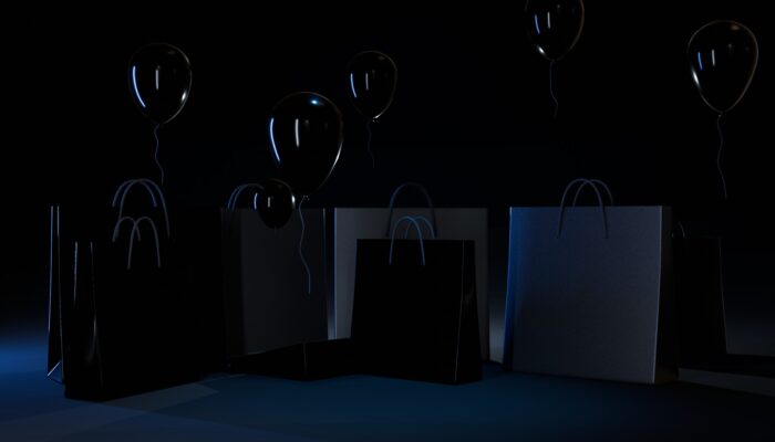 Black Friday 2025 Shopping Deals Consumers Behaviours Opinion. Photo by 3Dbabylon.com. shopping bags on black background